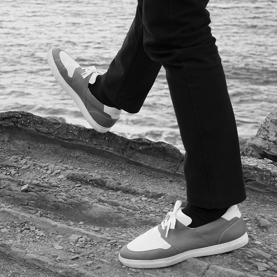 pyla-storm-shoes-wear-by-françois-alu-extended-on-a-black-sofa-big-size-picture