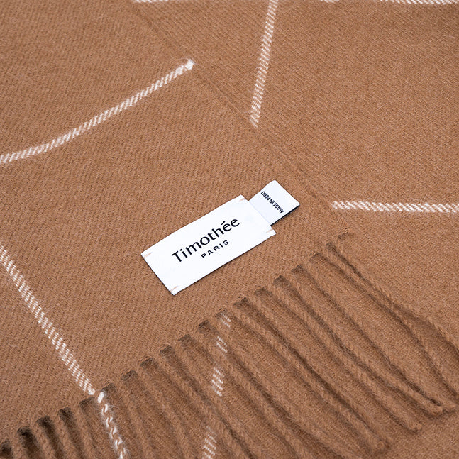 brown alpaca blanket by french-lifestyle brand timothee paris close up logo