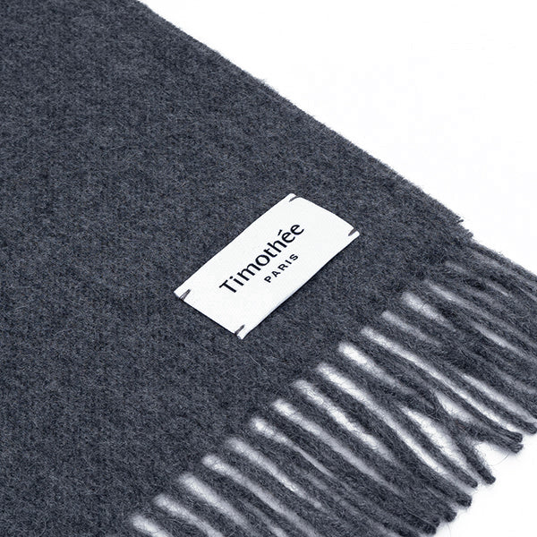 French contemporary artisan brand Timothee Paris dark grey clean baby alpaca scarf flat with logo tag