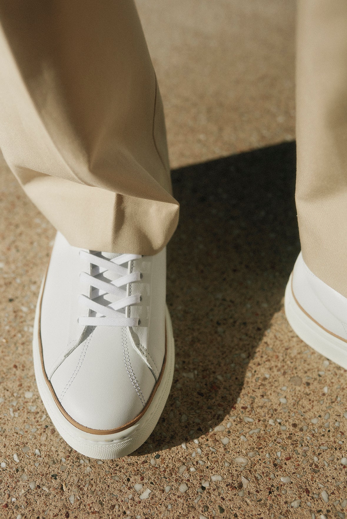 french white sneaker atlantique cloud worn with beige trousers timothee paris