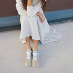 French sneaker brand timothee paris cabourg cloud taupe color worn with ivory skirt