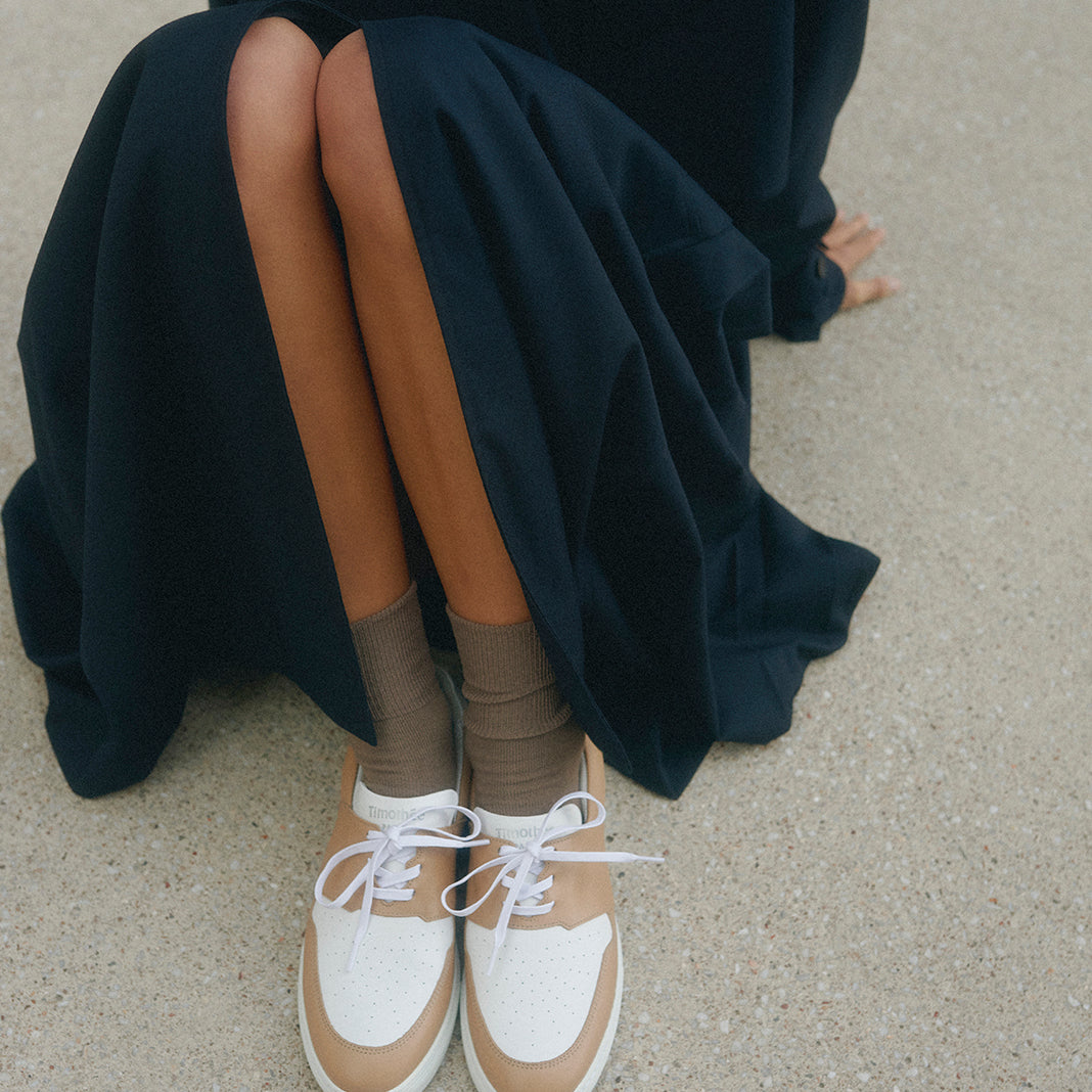 bi-coour french clean sneaker pyla worn with black dress Timothee Paris