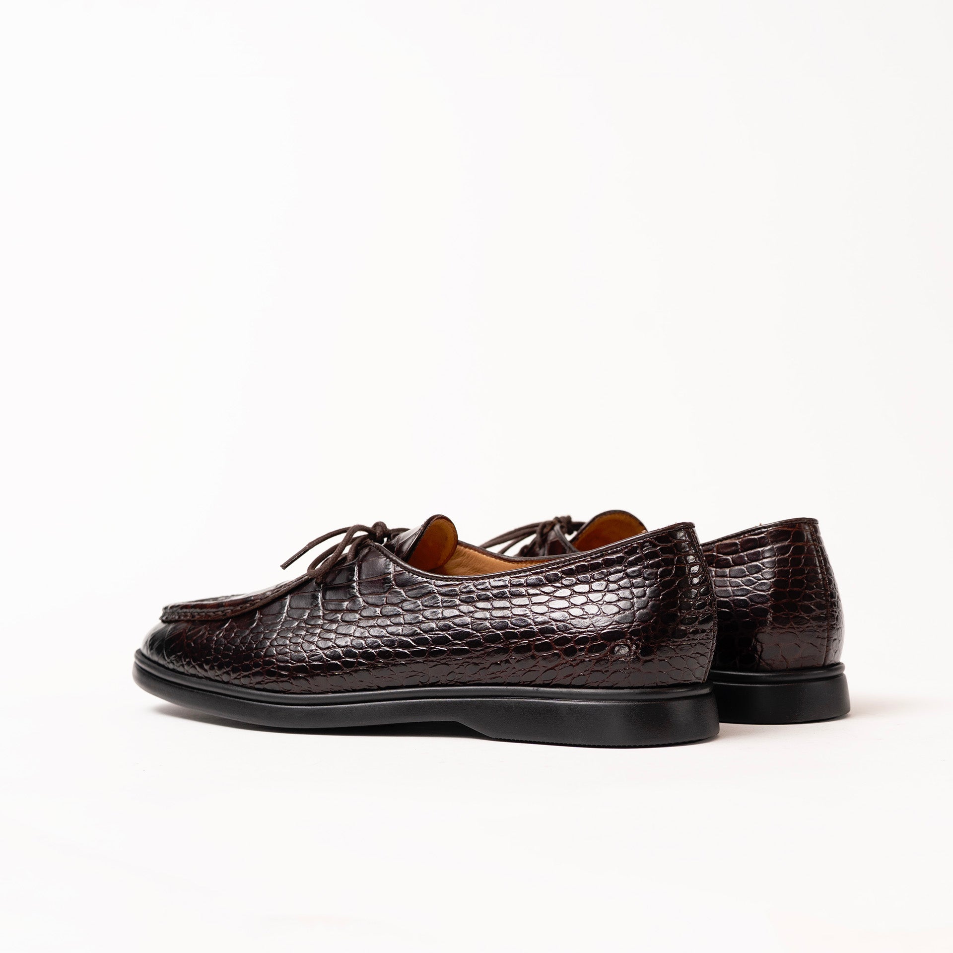 Pair of brown loafers on a white background