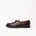 Dark brown crocodile-embossed leather loafer by Timothée Paris with a moccasin-style toe and a low black sole, shown in profile against a plain white background.