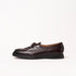 Dark brown crocodile-embossed leather loafer by Timothée Paris with a moccasin-style toe and a low black sole, shown in profile against a plain white background.