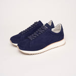 Quarter view of the Cabourg sneaker in navy blue by Timothée Paris, showcasing supple handcrafted leather and refined minimalist construction.