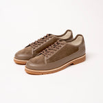 Pair of Timothée Paris brown suede shoes Y port with latex sole on a white background