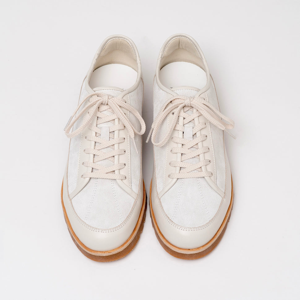 Pair of Timothee Paris Yport shoes on a light gray background