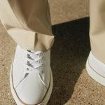 french white sneaker ATLANTIQUE cloud by Timothee Paris matched with beige chino trousers