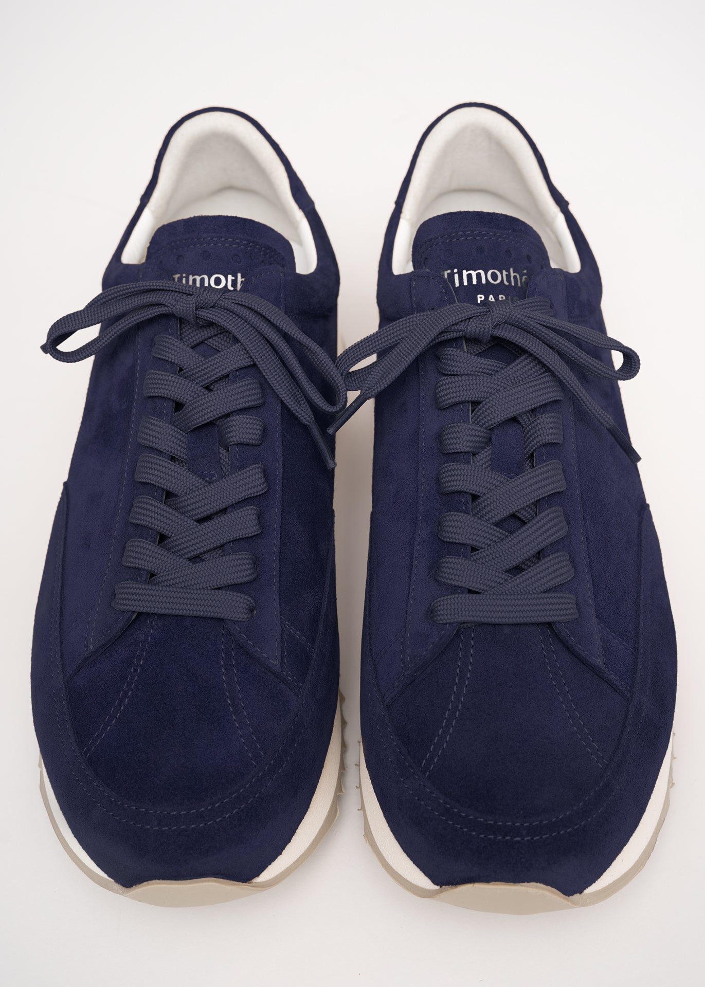 Top view of the Cabourg sneaker in navy blue by Timothée Paris, showcasing supple handcrafted leather and refined minimalist construction.
