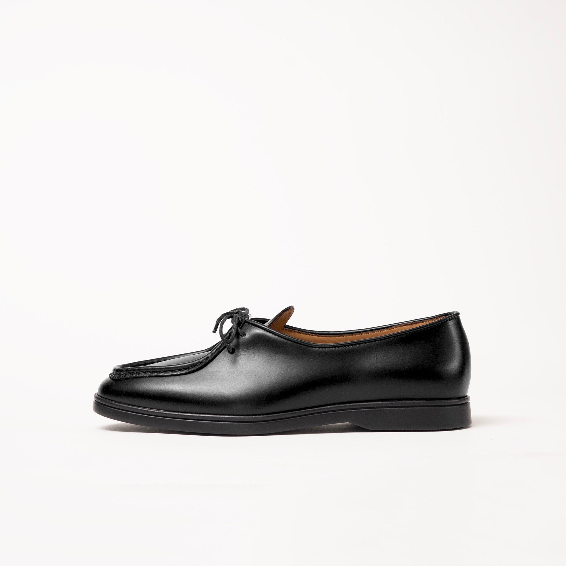 Side view of Beaune lace-up loafer by Timothée Paris, crafted in rich supple black pull-up leather highlighting its refined silhouette.