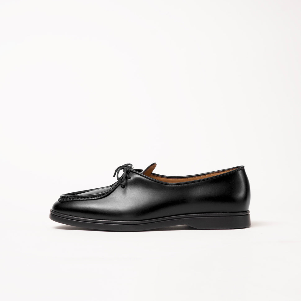 Side view of Beaune lace-up loafer by Timothée Paris, crafted in rich supple black pull-up leather highlighting its refined silhouette.