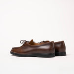 Back angle of Beaune lace-up loafer in smooth Cognac pull-up leather by Timothée Paris, emphasizing its minimalistic craftsmanship.