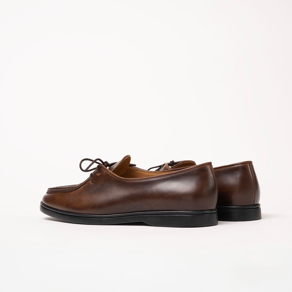 Back angle of Beaune lace-up loafer in smooth Cognac pull-up leather by Timothée Paris, emphasizing its minimalistic craftsmanship.