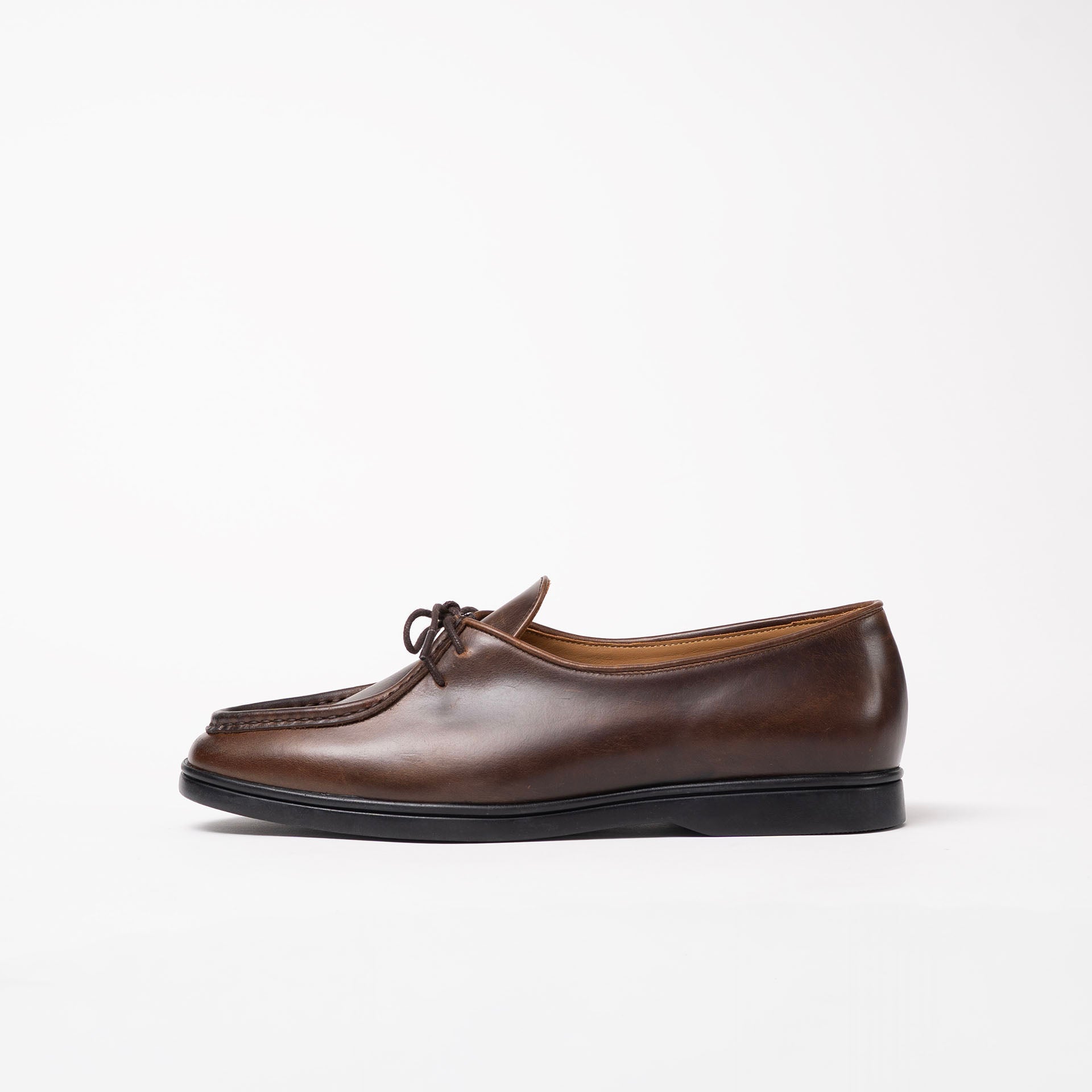 Side view of Beaune lace-up loafer by Timothée Paris, crafted in rich Cognac pull-up leather highlighting its refined silhouette.