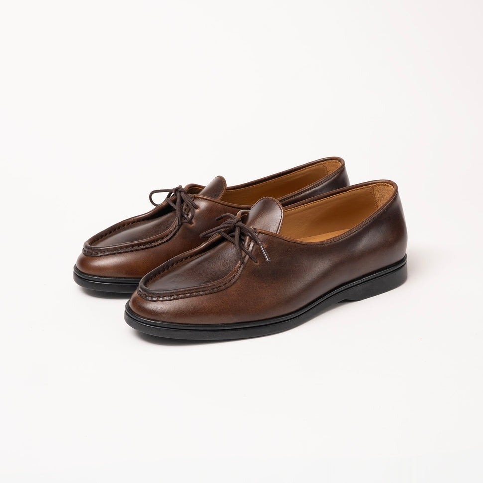 Three-quarter view of Beaune loafer in Cognac pull-up leather by Timothée Paris, showcasing the shoe’s elegant form and handcrafted details.