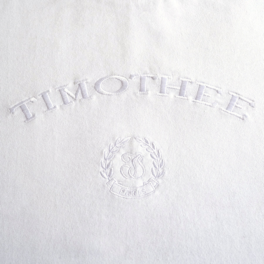 white-short-sleeve-embroidered-timothee-paris-monogram-logo-oversized-tshirt-detail-close-up-view