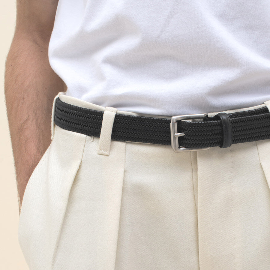 black braided belt elastic and adjustable by french brand timothee paris worn by a male model